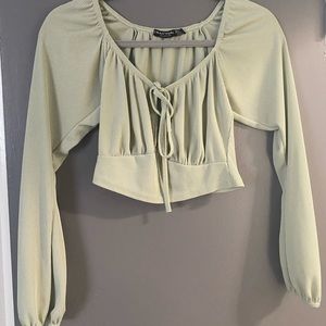 Mint top with adjustable strings in the front.